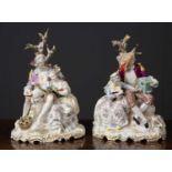 A pair of Continental pottery figure groups each depicting a young couple in a rural setting with