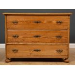 A pine chest of three long drawers with turned bun feet, 109cm wide x 56cm deep x 79cm highCondition