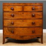 A Victorian mahogany and satinwood inlay bow fronted chest, of two short over three long drawers,