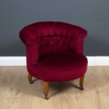 A late Victorian upholstered tub chair with square tapering legs and brass and ceramic casters, 71cm