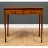 A Warings Edwardian mahogany inlaid two drawer writing table, with leatherette inset top, on