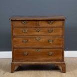 A Georgian mahogany chest of two short and three long graduated drawers with brass handles and