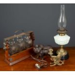 A set of three cut glass decanters in a wooden carrying case, each with a silver decanter label