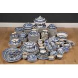 A Wedgwood Willow pattern part dinner service to include platters, tureens, a quantity of dinner