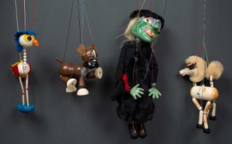 A group of five Pelham Puppets to include a standard puppet, a simple dancing puppet, a puppet