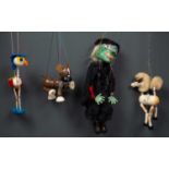 A group of five Pelham Puppets to include a standard puppet, a simple dancing puppet, a puppet