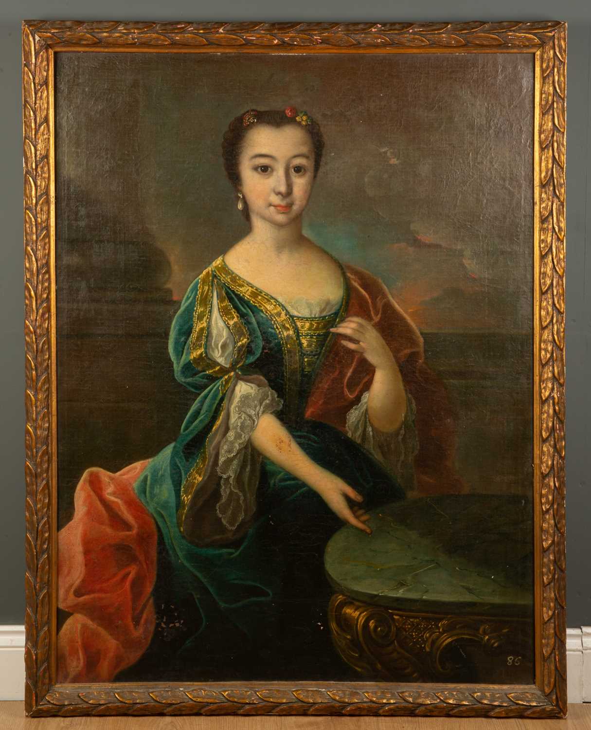 An 18th century portrait of a girl in a green velvet dress seated at a table, oil on canvas, 101.5cm - Image 2 of 10