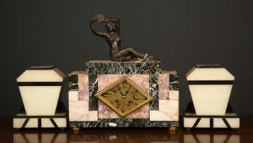 A French art deco marble garniture clock mounted with a spelter figurine of a dancing lady, the