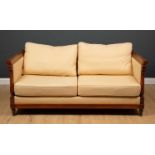 A Wesley-Barrell two seater mahogany framed Knole sofa, with cream upholstery within classical style