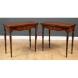 A pair of 19th century mahogany and satinwood marquetry inlaid fold over card tables with turned