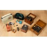 A collection of radios including; a Freeplay wind-up radio designed by Trevor Bayliss, 20cm high,