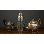 A George III silver teapot with marks for London 1809, with later chased and engraved decoration,