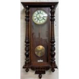 A late 19th / early 20th century Vienna type mahogany wall clock the enamelled dial with roman