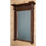 A 19th century neoclassical French dressing mirror, with bevelled oak and architectural carved