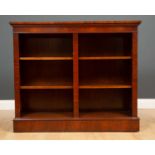 A late 20th century mahogany veneered open front bookcase with four adjustable shelves and a