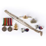 A small group of military related jewellery comprising Women's Royal Naval Service Regimental gold