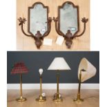 A pair of cast iron mirror backed two light girandoles with foliate decoration, 25cm wide x 60cm