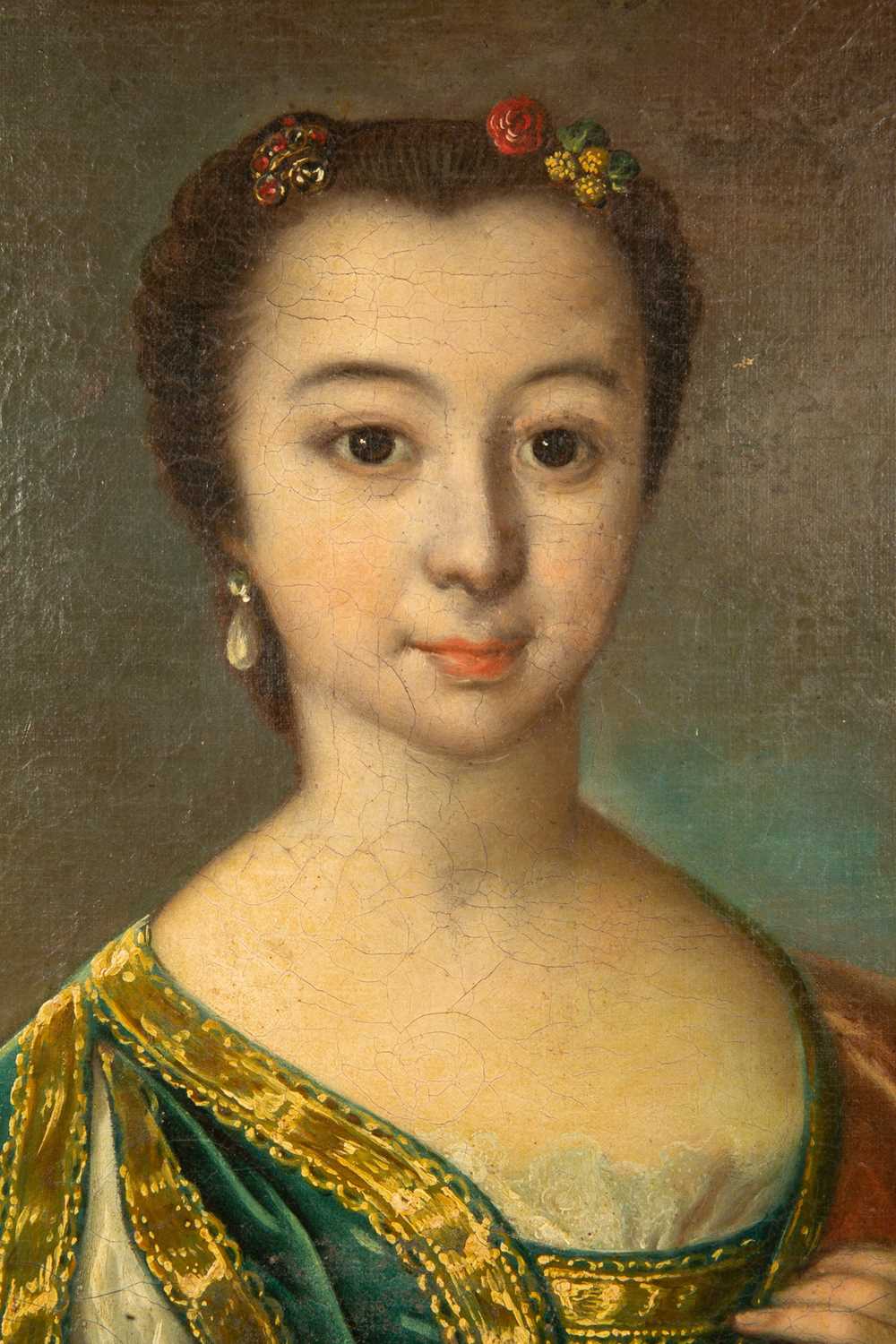 An 18th century portrait of a girl in a green velvet dress seated at a table, oil on canvas, 101.5cm - Image 4 of 10