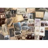 A folder of early 20th century and later photographs and prints and a small quantity of war time