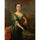 An 18th century portrait of a girl in a green velvet dress seated at a table, oil on canvas, 101.5cm