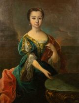 An 18th century portrait of a girl in a green velvet dress seated at a table, oil on canvas, 101.5cm