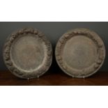 A near pair of 19th century pewter plates with an embossed fruit border and engraved with birds,