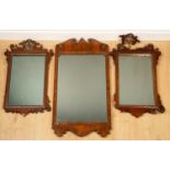 Two similar George III mahogany fret framed wall mirrors each with Hoho bird crests, 42cm wide x