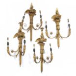 A set of four 19th century carved gilt wood wall lights, each with twin scrolling branches