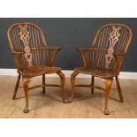 A pair of 20th century ash and elm spindle back Windsor chairs with cabriole legs, with crinoline