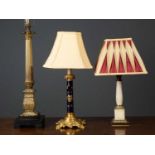 A group of three table lamps each formed as a classical column, one with blue and gilt foliate