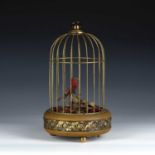 Birdcage automaton, 20th century, brass-cased, with a dome top, with suspension loop, a singing bird