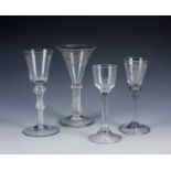 Four ale and wine glasses, English, 18th/19th Century, to include an etched wine glass, with air