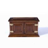 Oak desk or stationery box with fielded panelled doors and a fitted interior, 52cm x 28cm x