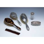 Three silver mounted dressing table brushes a silver-mounted comb and two cut glass dressing table