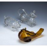 Three glass friggers two of which are novelty animal examples, and an amber glass bird example,