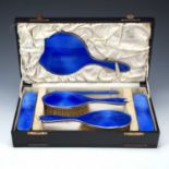Cased six piece dressing table set silver and blue guilloche enamel consisting of: a handheld
