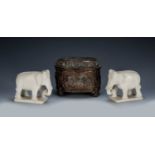 Pair of alabaster model elephants Indian, 10cm long, and an oval copper casket with 'Teniers' type