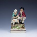 Staffordshire pearlware figure 19th Century, entitled Tendernefs (Tenderness), modelled as two