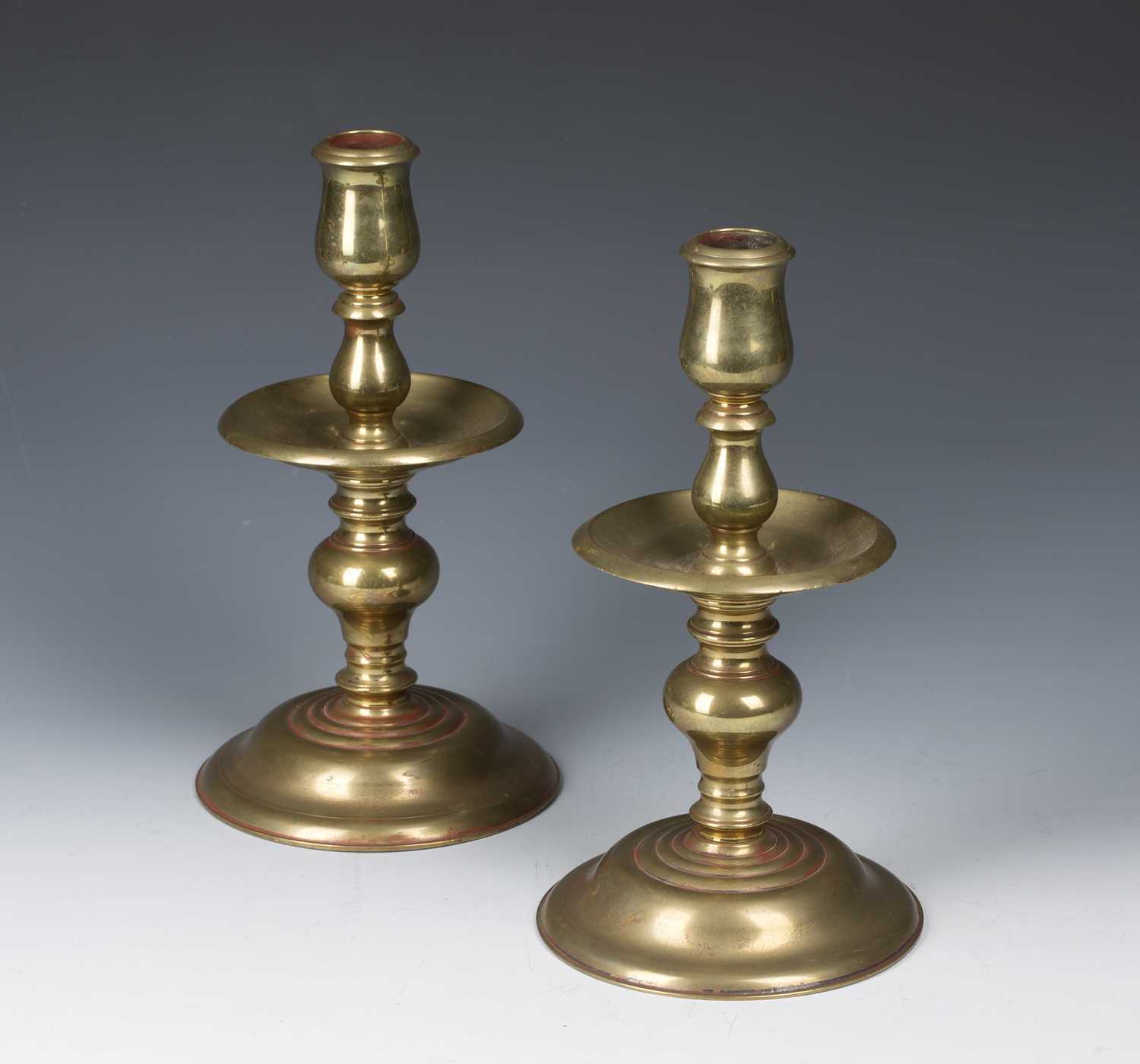 Pair of brass candlesticks with wide circular drip trays on knopped stems, terminating in socle - Image 2 of 2