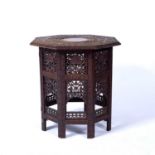 Carved hardwood Burmese table with hexagonal top, early 20th Century, fretwork decoration