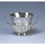 Queen Anne miniature silver porringer with twin handles, half fluted body and foliate impressed