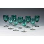 Matched set of nine drinking glasses handblown, with a slight variation of heights, clear stem