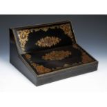 In the manner of Austins of Dublin Ebonised and coromandel writing slope, Victorian, inlaid with