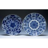 Two Delft blue and white chargers Dutch, 18th Century, one with simple spray design and the other