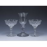 Heavy wine goblet 19th Century, with a facet stem, 23.5cm and a pair of glass bonbonnieres, 17cm