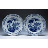 Pair of Delft blue and white pottery chargers Dutch, circa 1780 each painted in the Chinese manner