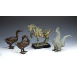 Collection of pieces to include: Tang style cast metal model of a horse on wooden plinth,