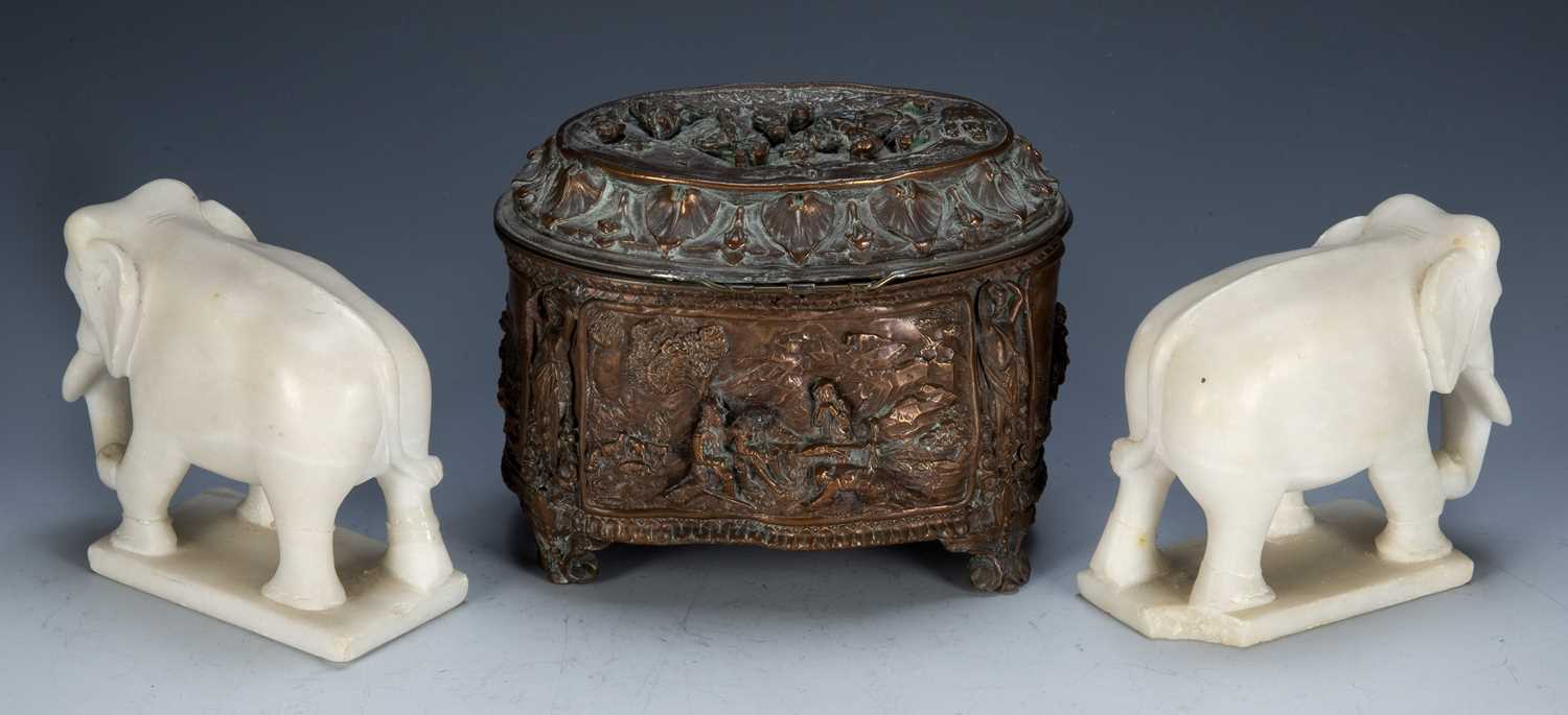 Pair of alabaster model elephants Indian, 10cm long, and an oval copper casket with 'Teniers' type - Image 3 of 3