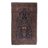 Kashan rug of blue ground, with a tree of life design within a foliate border, 220cm x