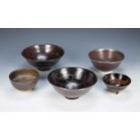 Doug Jones (Contemporary) collection of studio pottery bowls, iron glazed bowls with painted